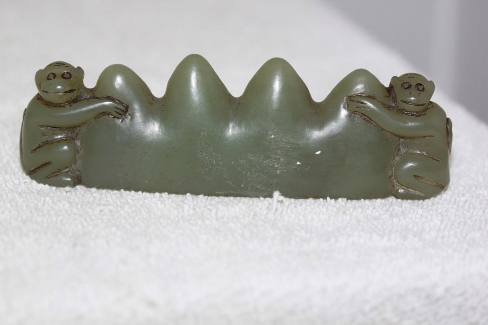 A Jade Brush Rest: 4 3/4" long