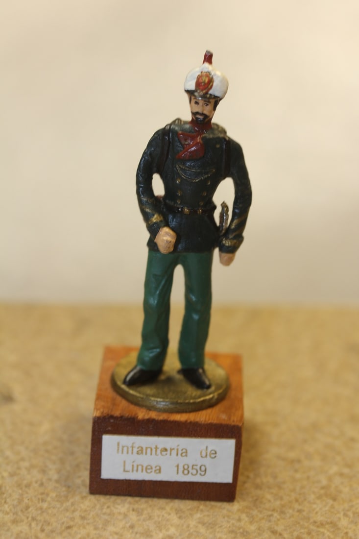 Metal Soldier on Wooden Stand: overall= 3 1/4" tall
