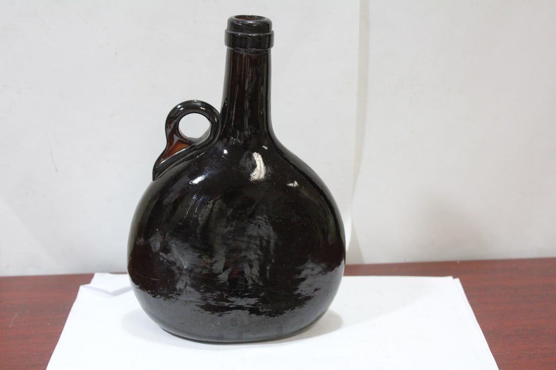 A Vintage/Antique 1800's Liquor Bottle: glass - 8 1/2" tall