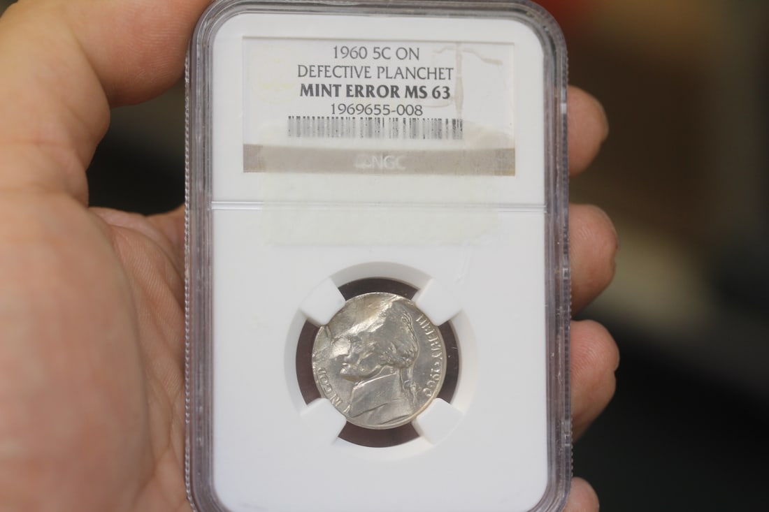 NGC Graded 1960 5 Cent Mint Error Coin: MS63 - on defective planchet - rare