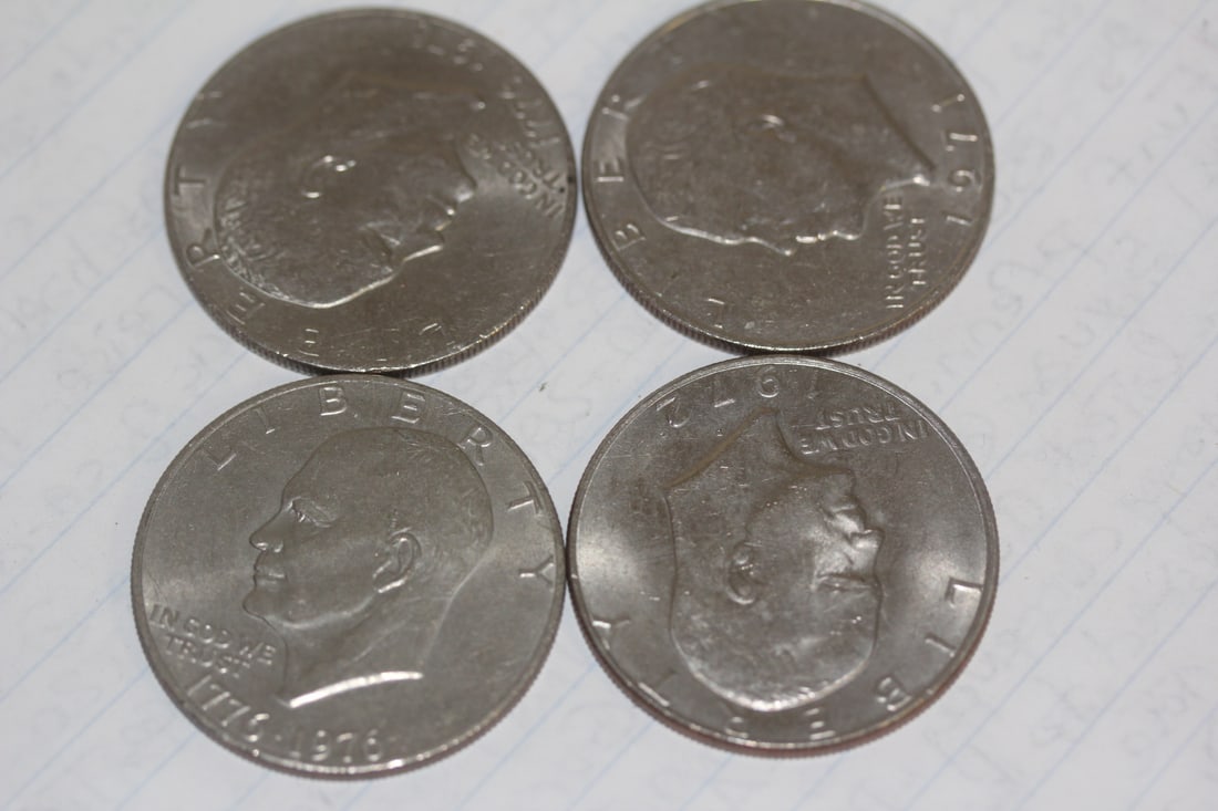Lot of 4 Clad Ike Dollars: as shown