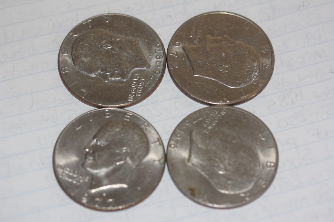 Lot of 4 Clad Ike Dollars: as shown