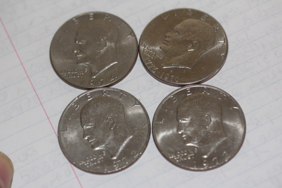 Lot of 4 Clad Ike Dollars: as shown