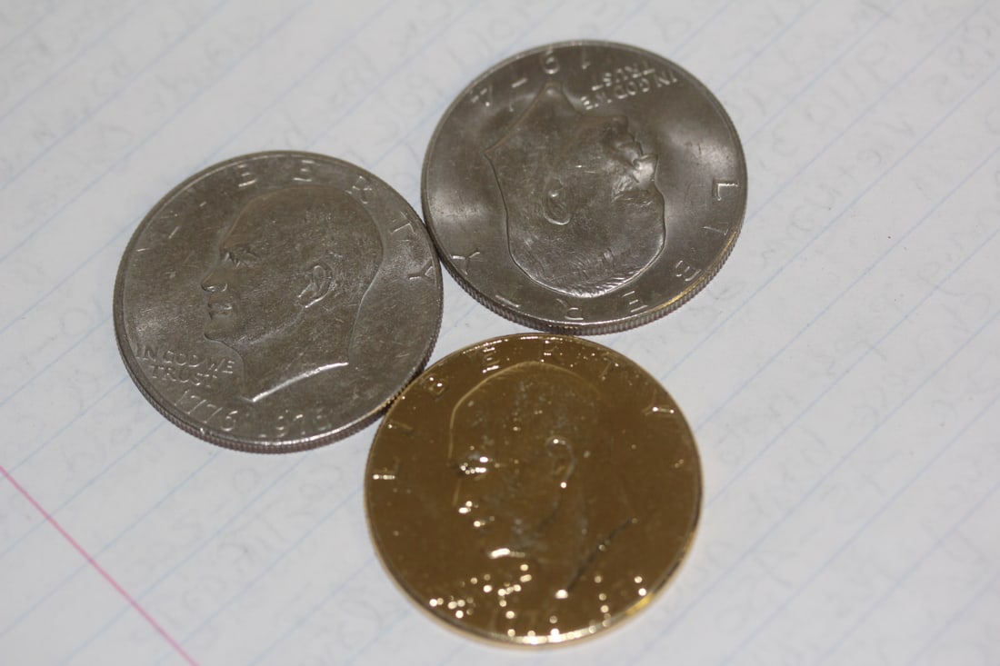 Lot of 3 Clad Ike Dollars: to include a gold plated one