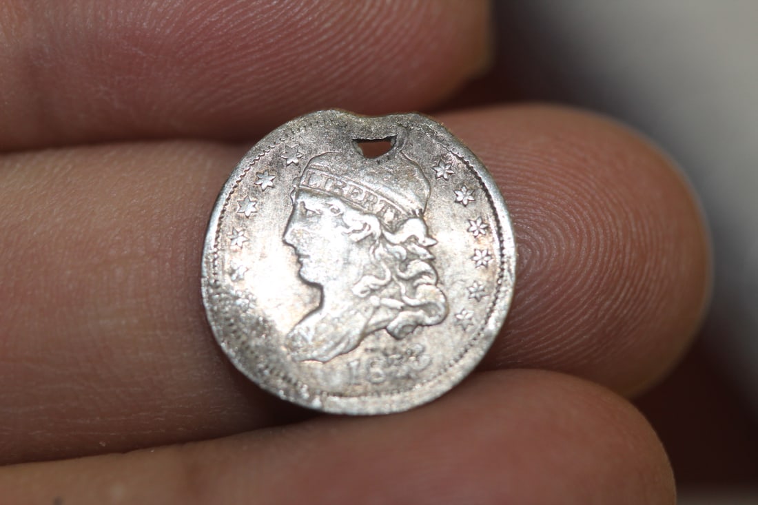 An 1833 Bust Half Dime: please note: hole