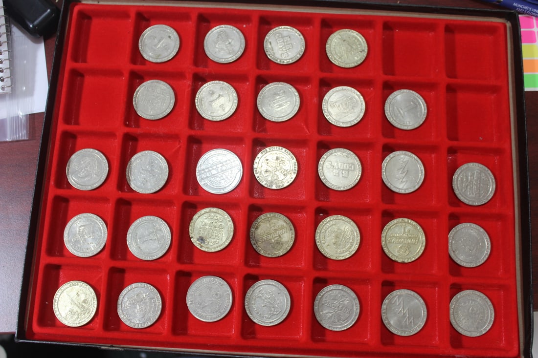 Lot of 30 Clad Casino Tokens: please note: display case is not included