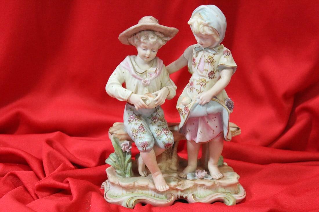 A Ceramic Figure: please note: missing fingers as shown - 7" tall