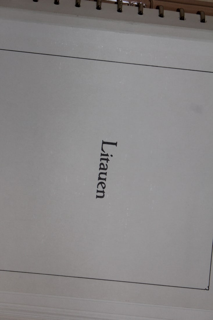 Lietuva Stamp Album: almost entire book is empty with a few stamps on the back pages as shown - slip case