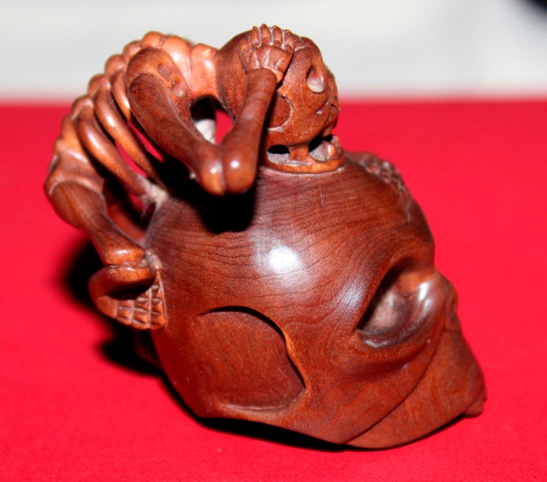 Antique Japanese Boxwood Netsuke: Probably Edo period (19th century). Approximately 2" tall. Signed.