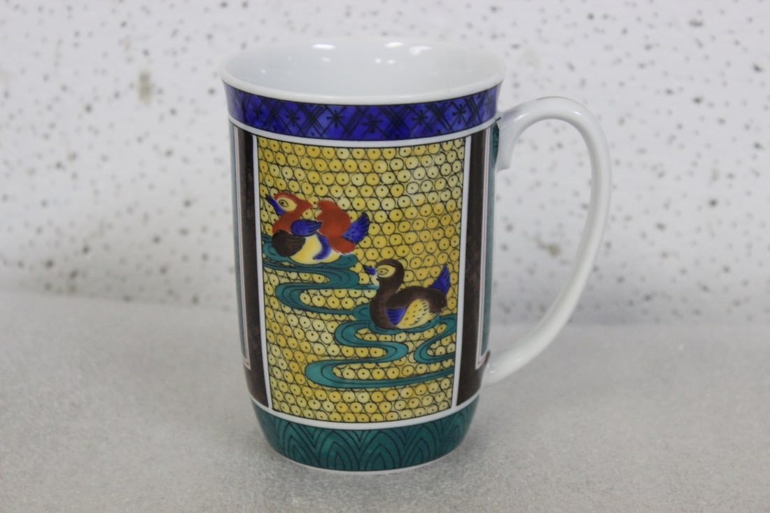 A Chinese or Oriental Cup: Signed on the bottom- nicely decorated - 4 inches tall