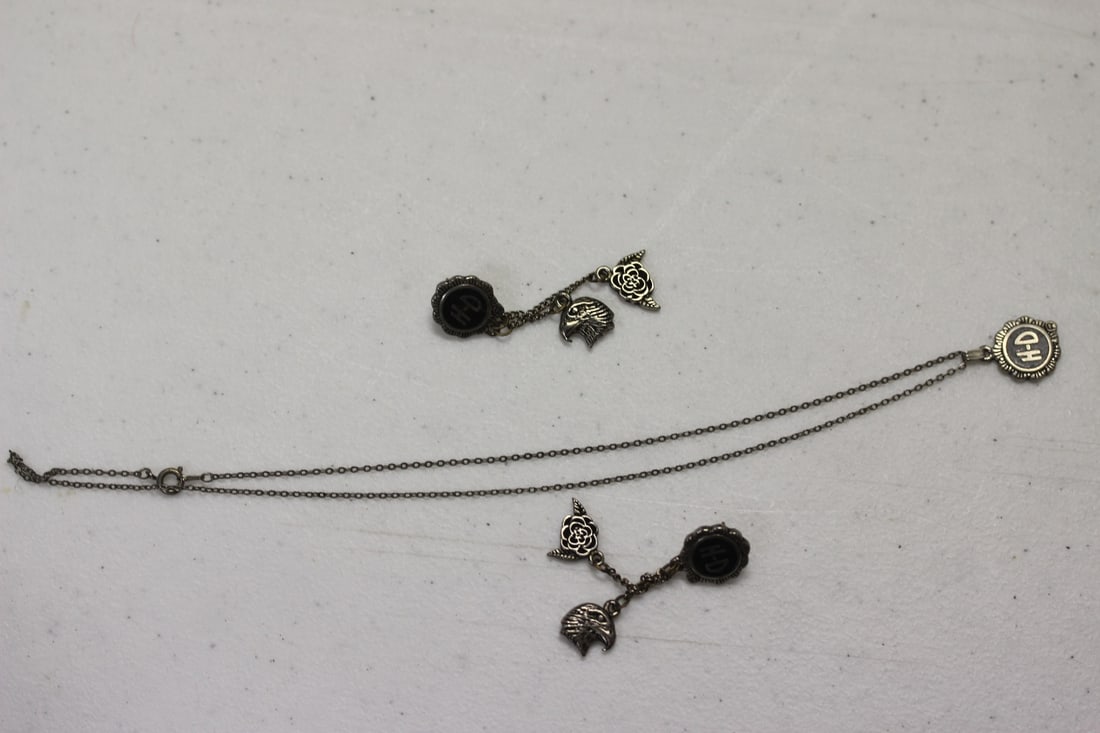A Suite of Harley Davidson Jewelry: Pair of earrings and a necklace