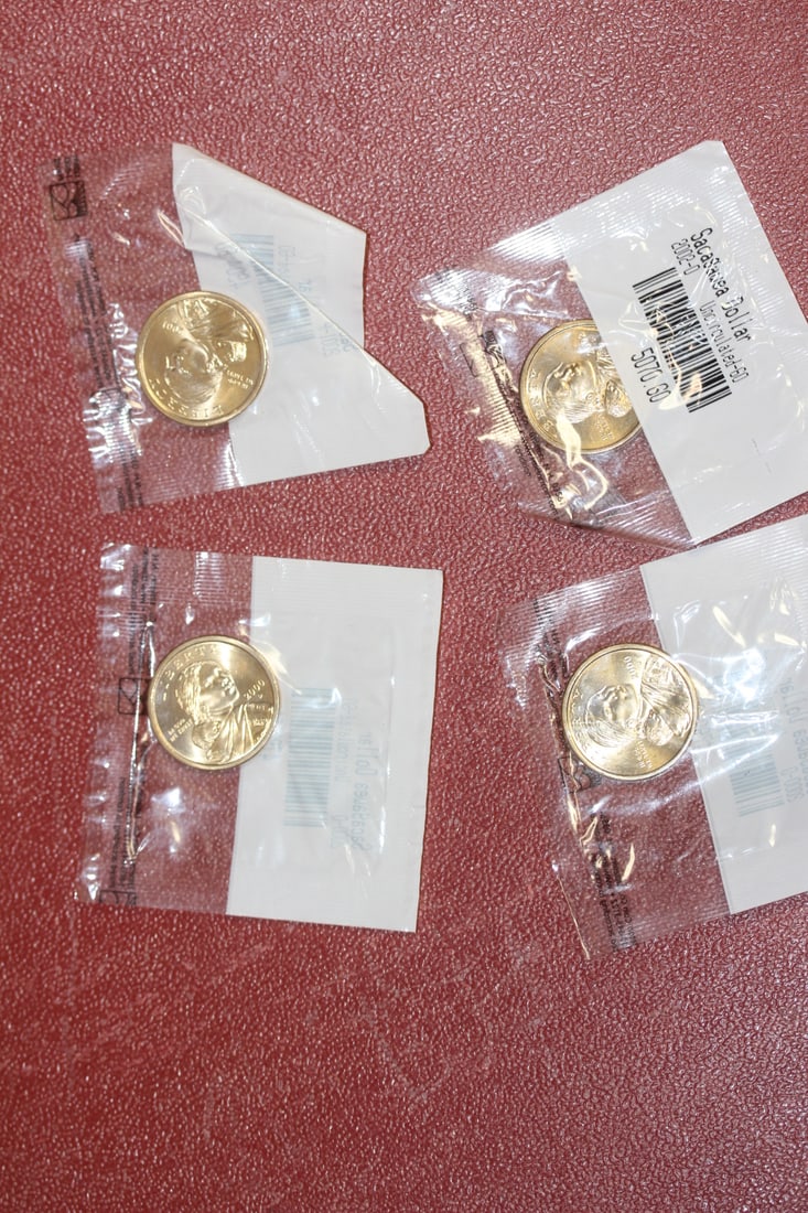 Lot of 4 Uncirculated Sacagawea Dollar: still sealed - by the Littleton Coin company