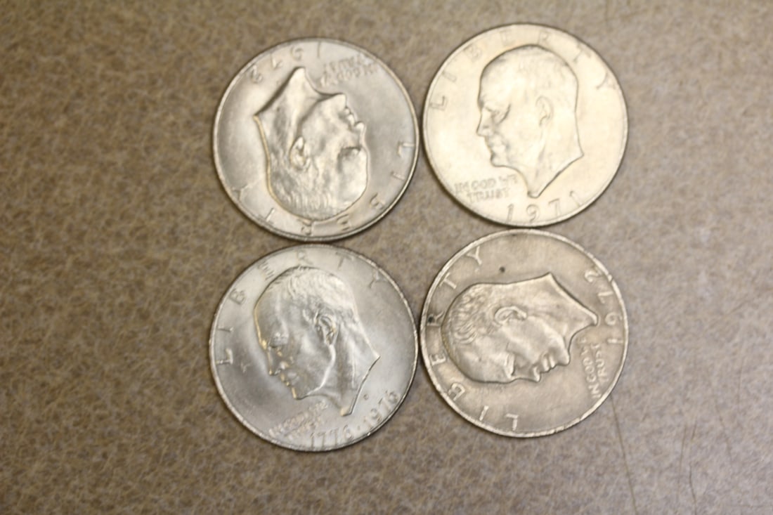 Lot of 4 Clad Ike Dollars: as shown