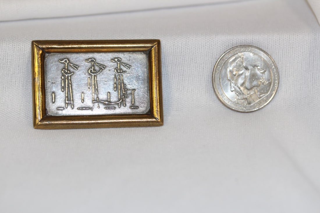 A Sterling and Brass Brooch: as shown