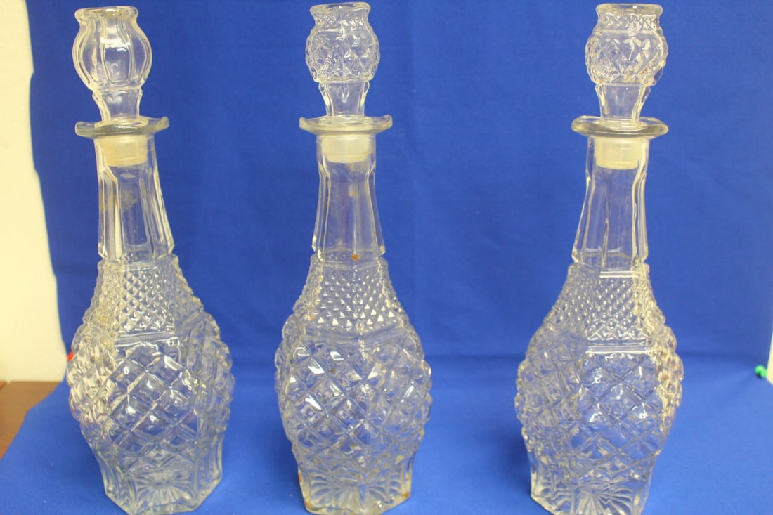 Lot of 3 Pressed Glass Decanters: each measures approximately 14" tall including the stopper