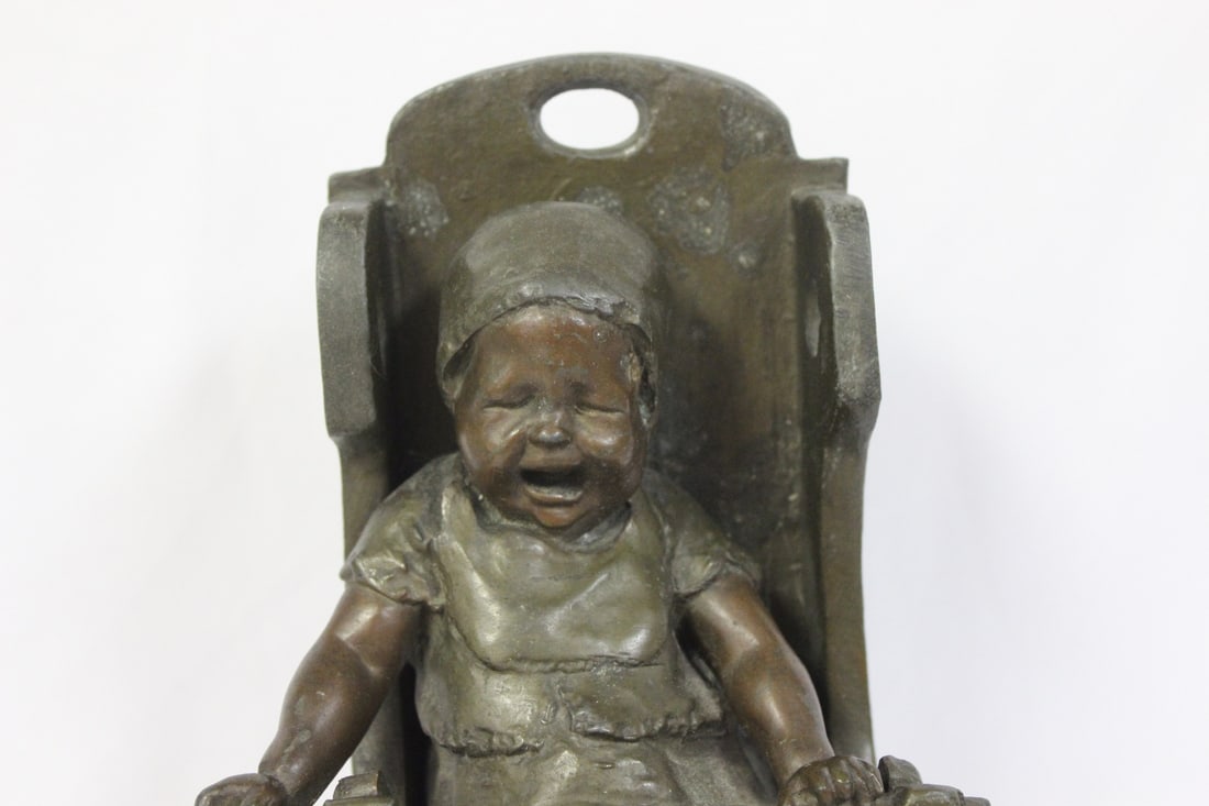 A Bronze Child on a High Chair by Steiner - 2
