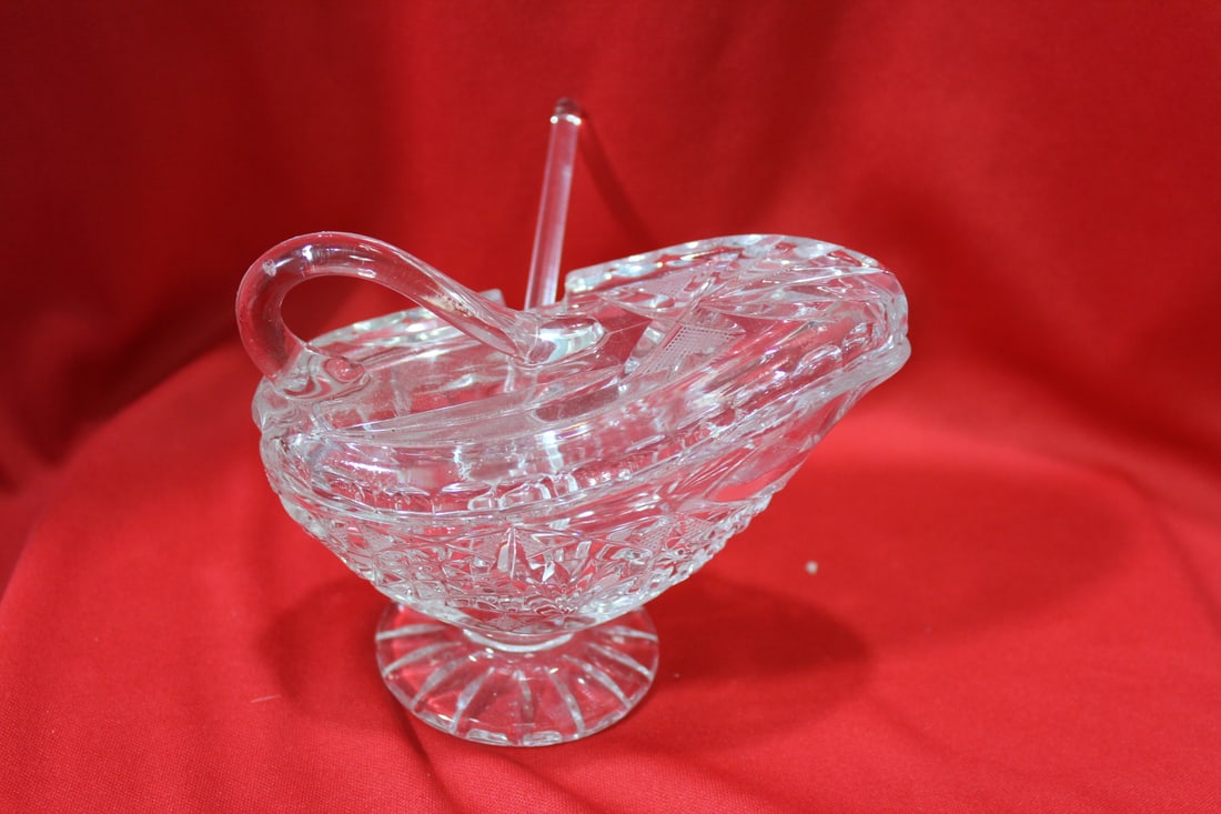 A Glass or Crystal Container: with lid and spoon - 5 inches across