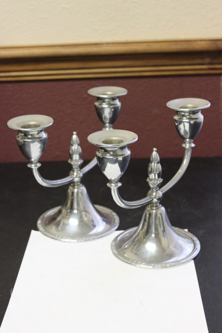 A Pair of Metal Candle Sticks: 9 inches wide
