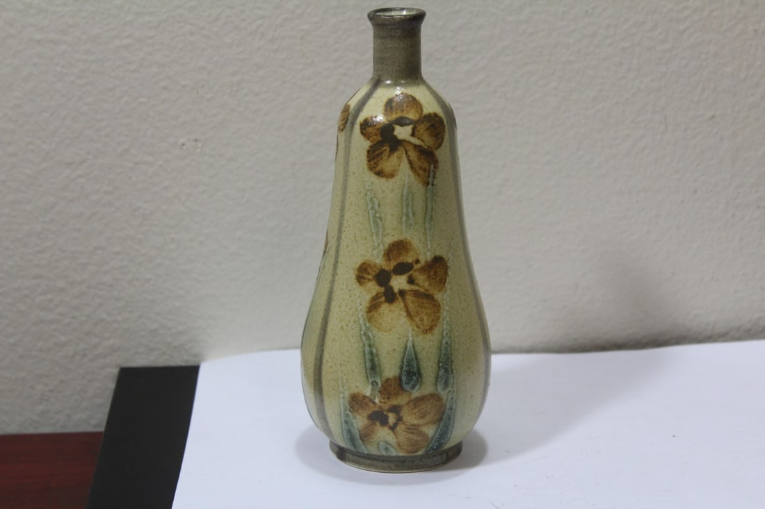 A Ceramic Bottle: appears to be a studio piece - unsigned - 7 inches tall - a nice loking piece