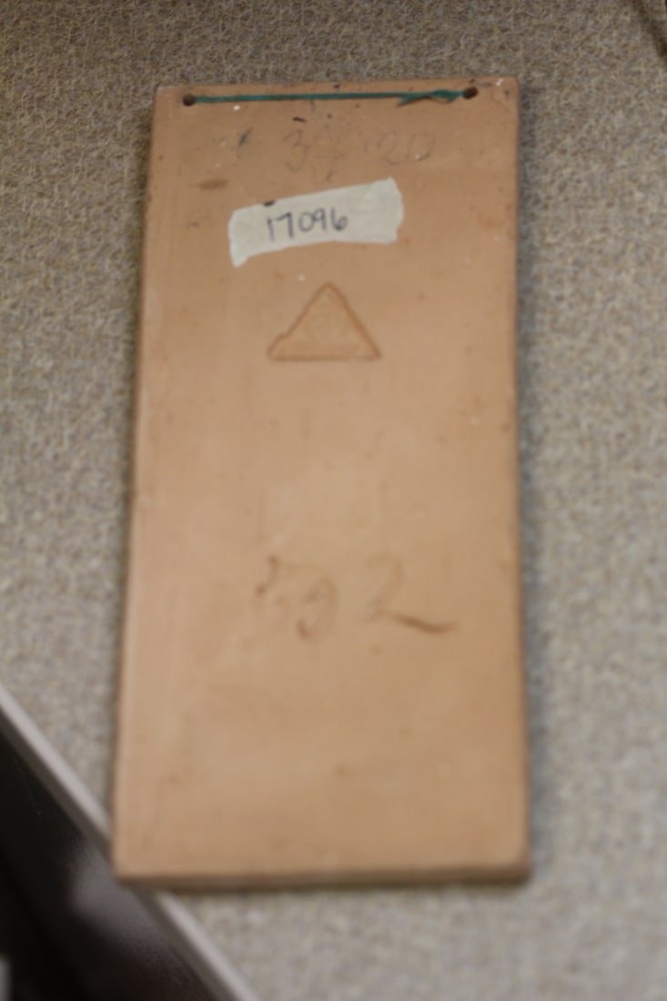 A Signed Tile of a King? - 2