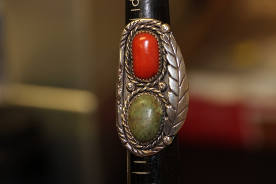A Navajo Sterling and Torquise and Coral Ring: Size 8 - face of the ring = 2 inches long