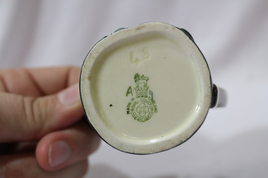 A Royal Doulton Miniature Mug - 7