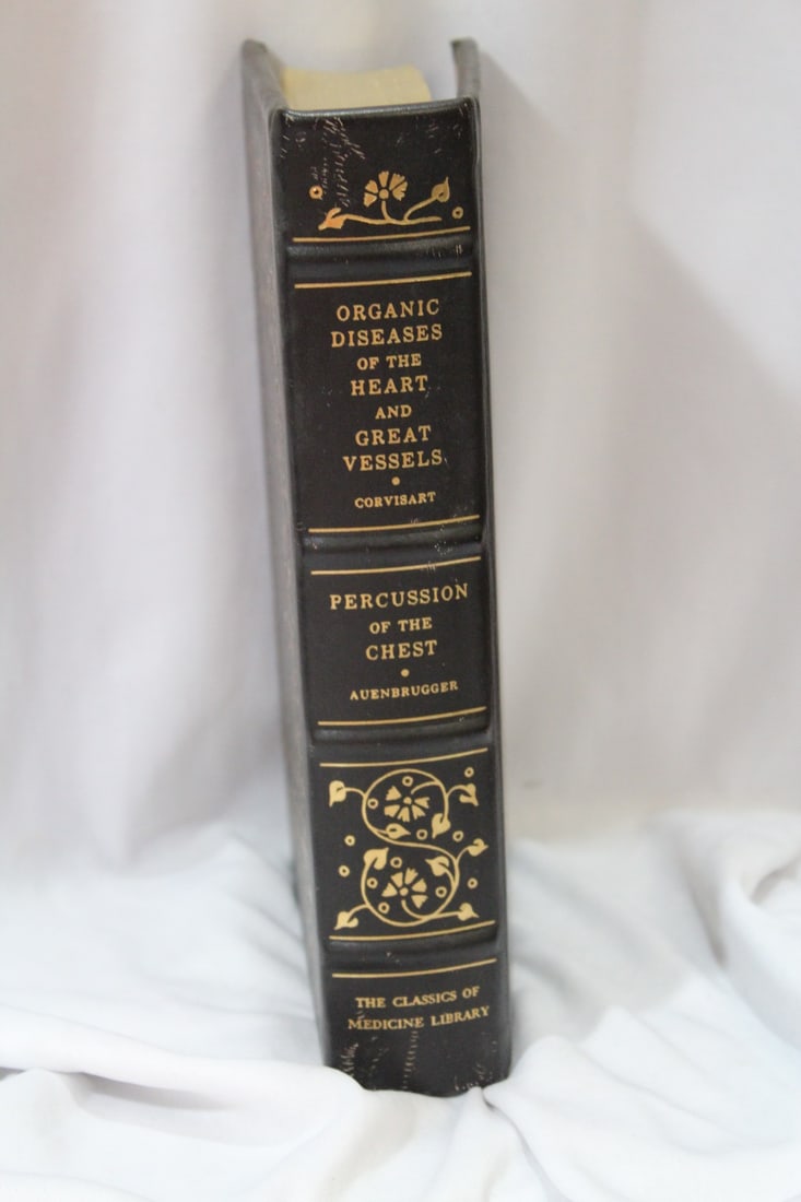 A Leatherbound Hardcover Book on Heart Disease: as shown