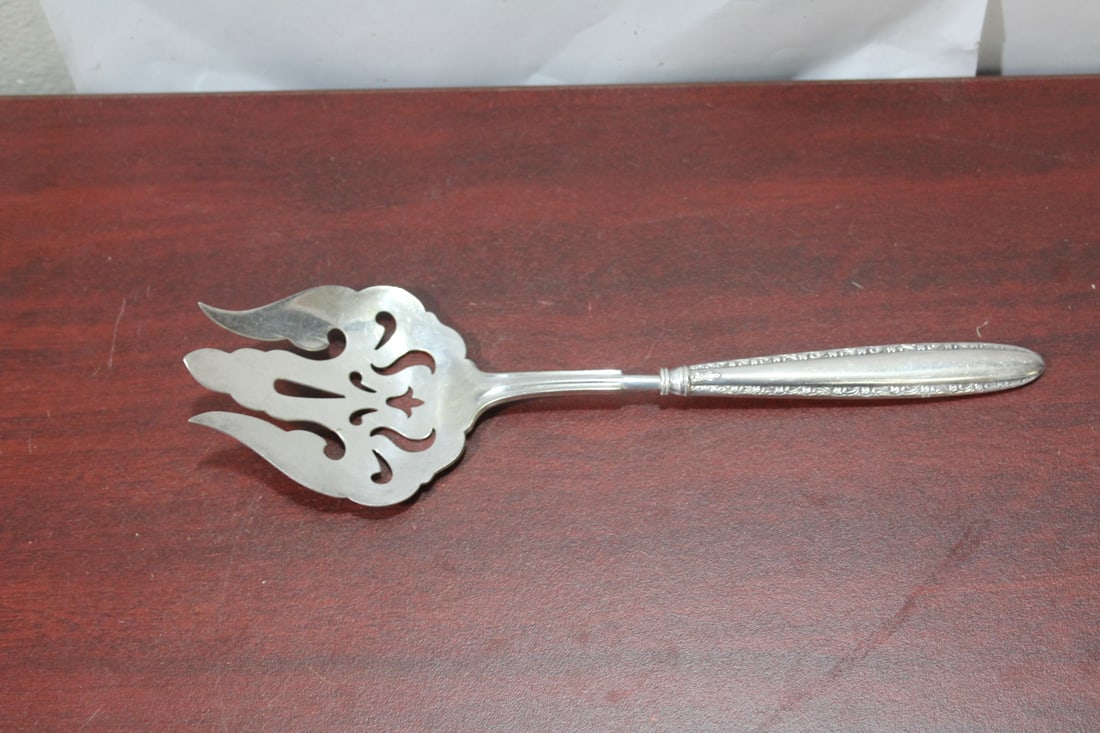 A Sterling Handle Serving Fork: 9 1/2" across