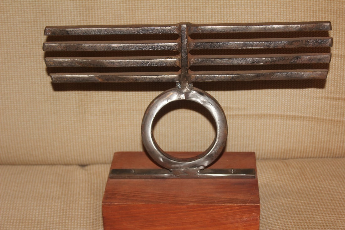 Signed Metal Sculpture on Wood: 11" across