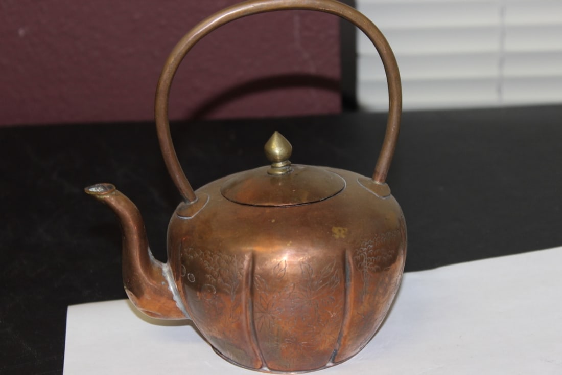 A Copper Teapot: probably Chinese - 6" long x 7 1/4" tall including handle