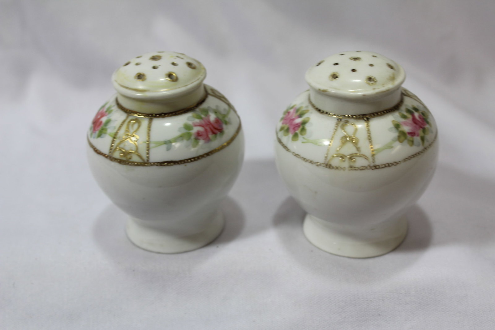 A Pair of Vintage Salt and Pepper Shakers: 2 3/4" tall each