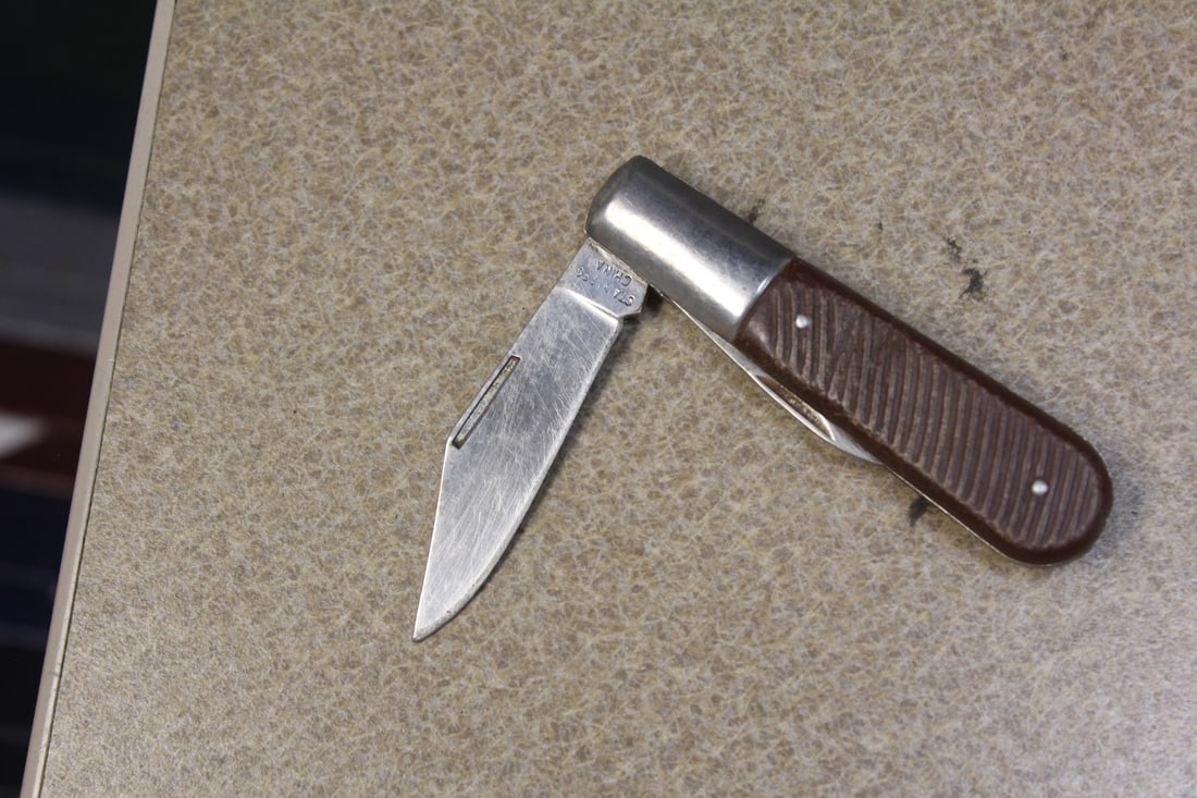 Pocket Knife: 3 3/8" across