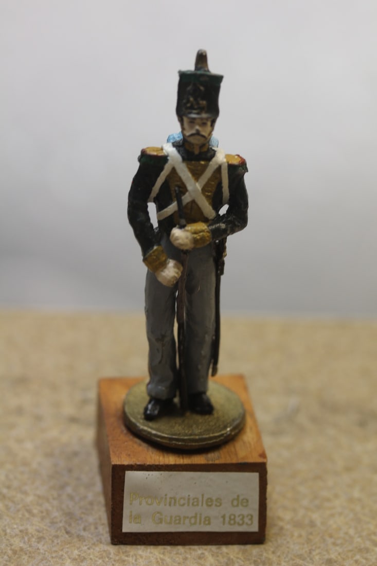 Metal Soldier on Wooden Stand: overall= 3 1/4" tall