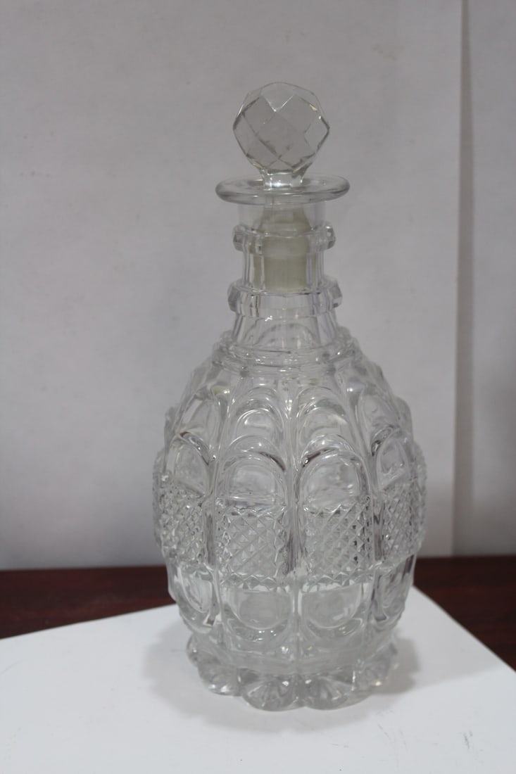 A Pressed Glass Decanter: please note: stopper is chipped as shown - 9 1/2" tall