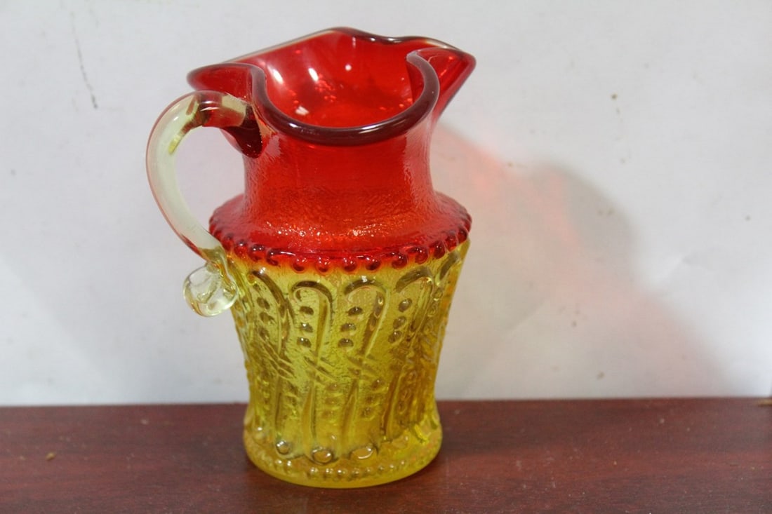 A Cranberry and Amber Small Glass Pitcher: 4 1/4" tall