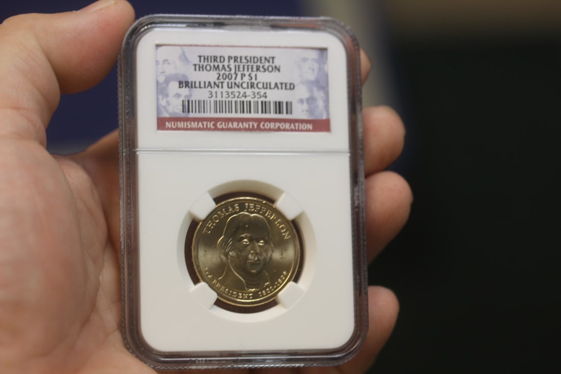 NGC Graded One Dollar Gold Plated Coin: as shown