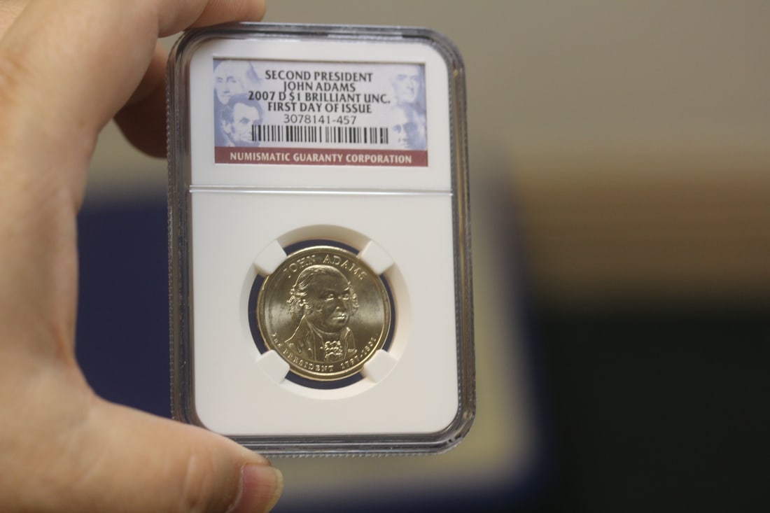 NGC Graded One Dollar Gold Plated Coin: as shown