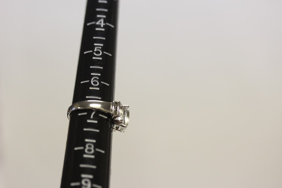 A Sterling Ring with Clear Stones - 12