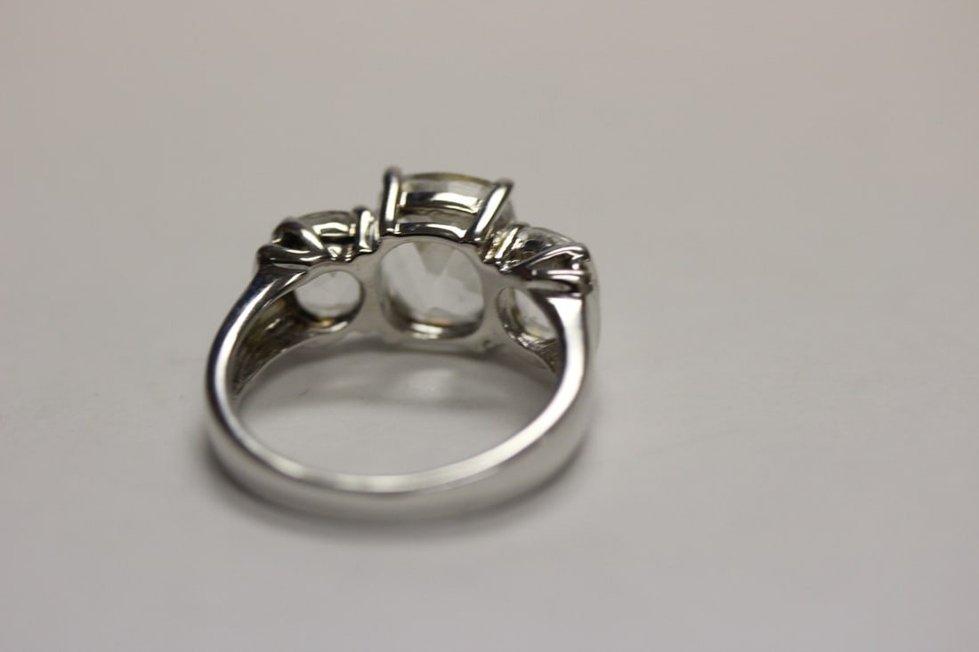A Sterling Ring with Clear Stones - 4