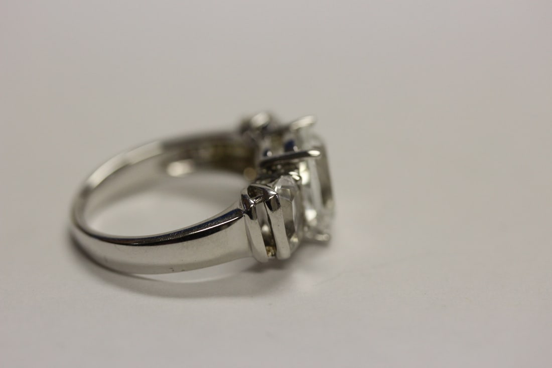 A Sterling Ring with Clear Stones - 5