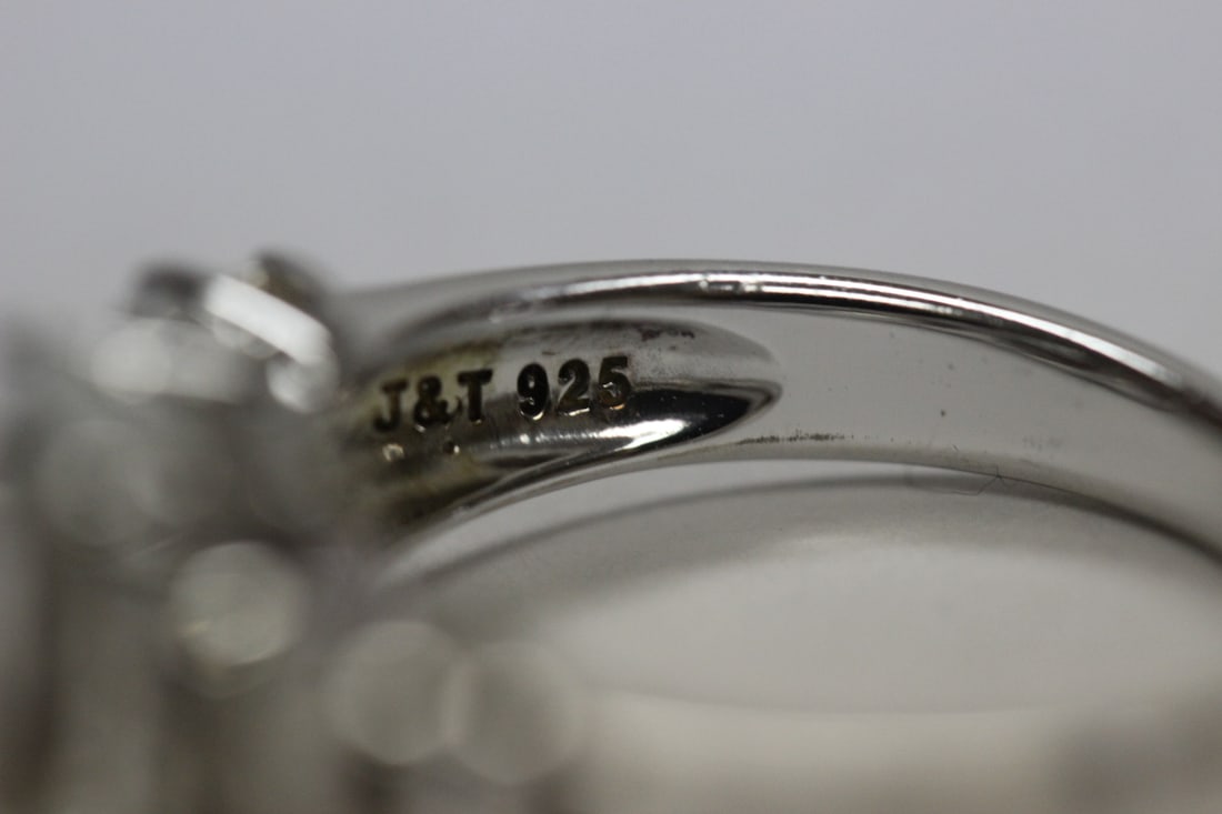 A Sterling Ring with Clear Stones - 6