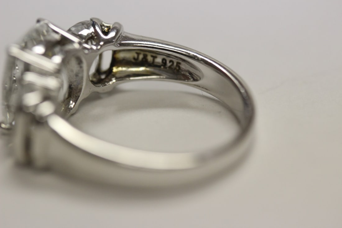 A Sterling Ring with Clear Stones - 7