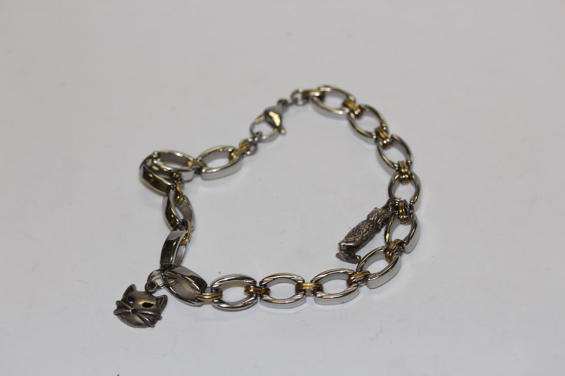A Sterling INOX Bracelet: with charms - 4 1/2" when clapsed