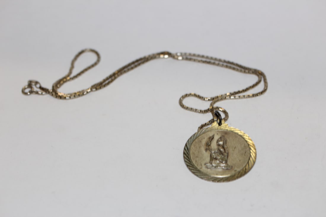 A Sterling Italian Necklace: with pendant - measures 11 inches in overall with the necklace clasped