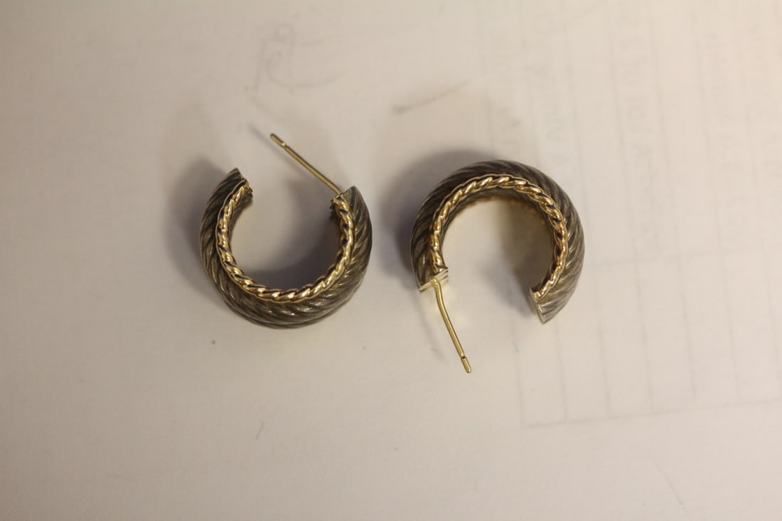A Pair of 14 Karat Gold and Sterling Earrings: nicelly designed