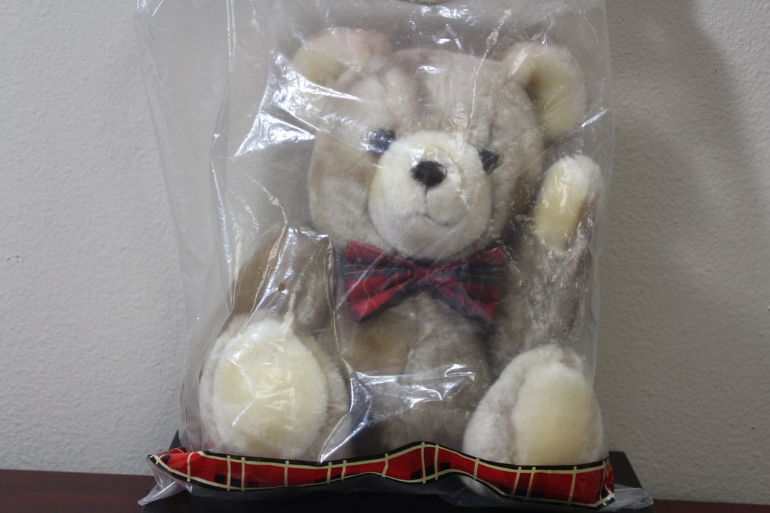 An Avon Huggie Bear: still inside a plastic bag - approximately 9 inches tall
