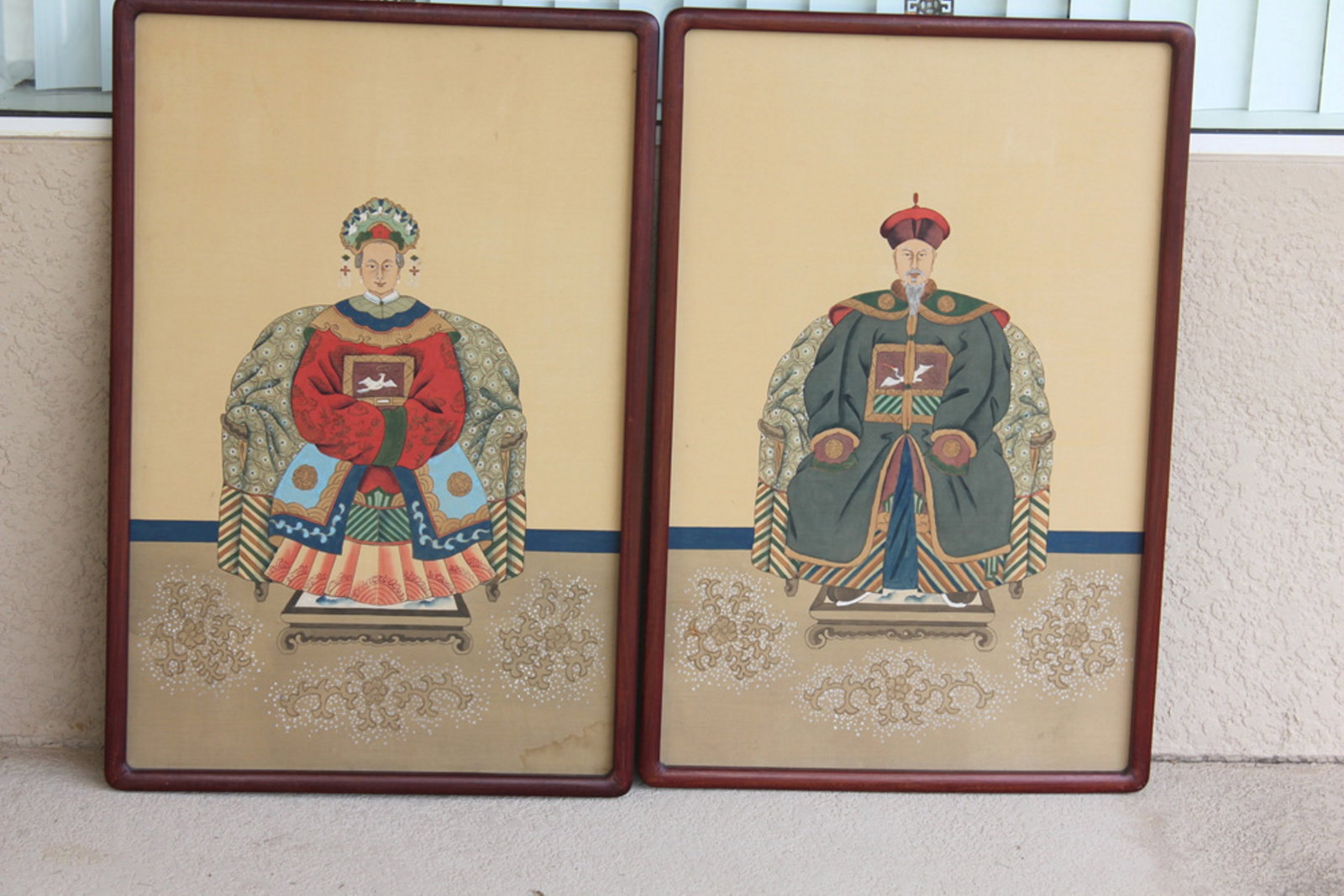 Pair of Chinese Ancestral Pastel on Silk: Circa mid 20th century. Framed by rosewood. Overall 36" x 24".