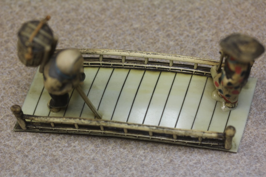 Vintage Japanese Two Pople Crossing a Bridge: bakelite/plastic - 4 inches across