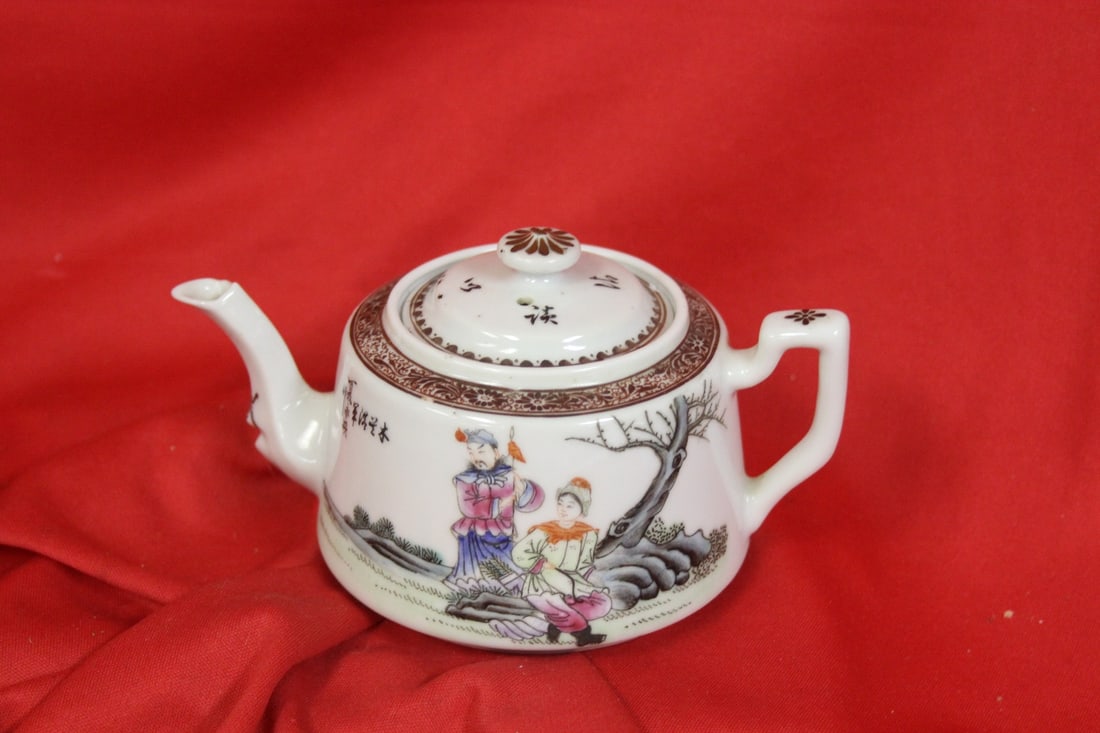 A Beautiful Antique Chinese Teapot: Handpainted and artist signed - marked China - signature on the bottom, can hardly be seen - 6 inches across, including the handle