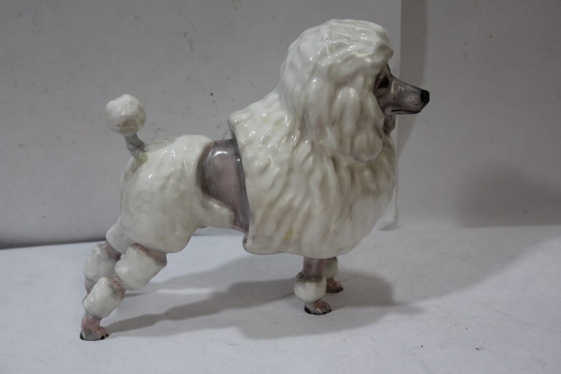 A Ceramic Poodle: please note: tail is restored - approximately 6 inches across